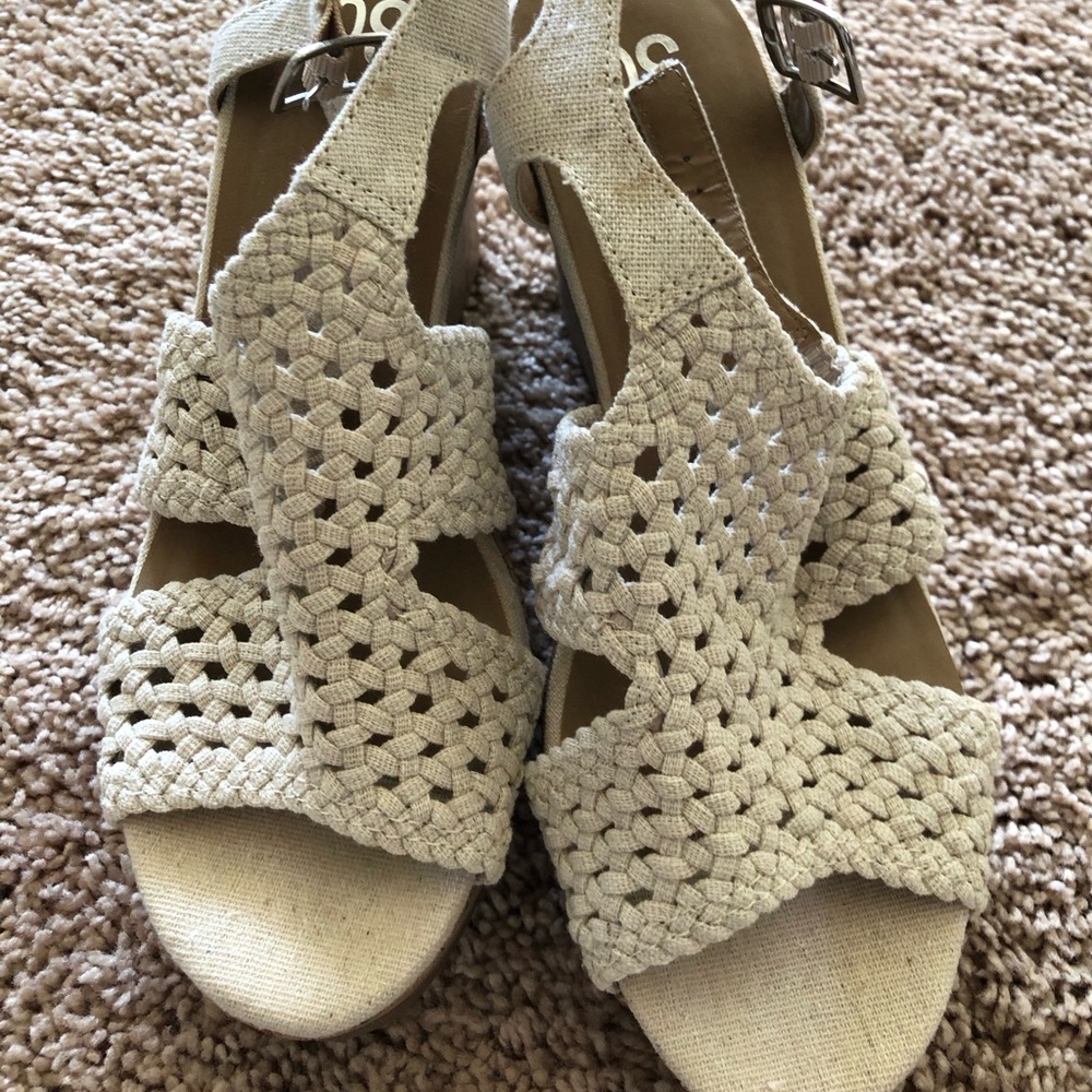 Cream lattice wedge platform sandals.